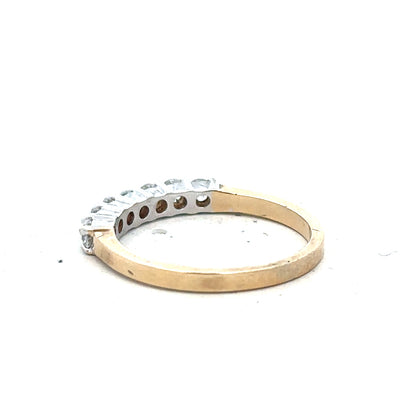 9ct yellow gold ring in size P with a simple band design, unbranded, shown from a side angle.