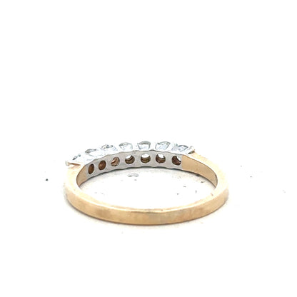 9ct yellow gold ring in size P with a smooth band, unbranded jewelry piece, shown from a side view.