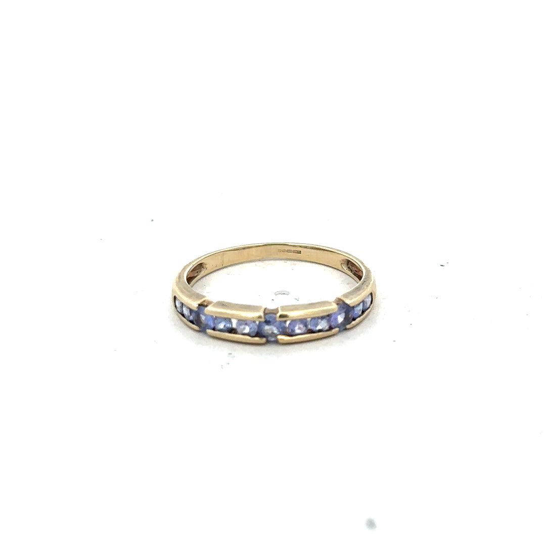 9ct yellow gold ring in size P with a smooth band, unbranded jewelry piece displayed against a neutral background.