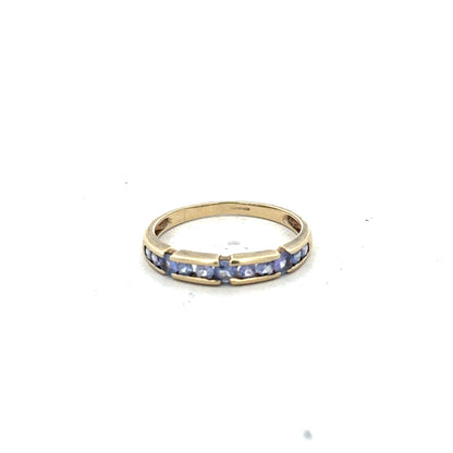 9ct yellow gold ring in size P with a smooth band, unbranded jewelry piece displayed against a neutral background.
