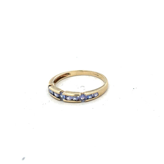 9ct yellow gold ring in size P with a smooth band, unbranded jewelry accessory, shown from a side angle.