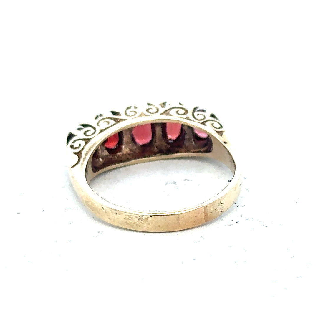 9ct yellow gold ring in size Q with a smooth band, unbranded jewelry piece, shown in a close-up image.