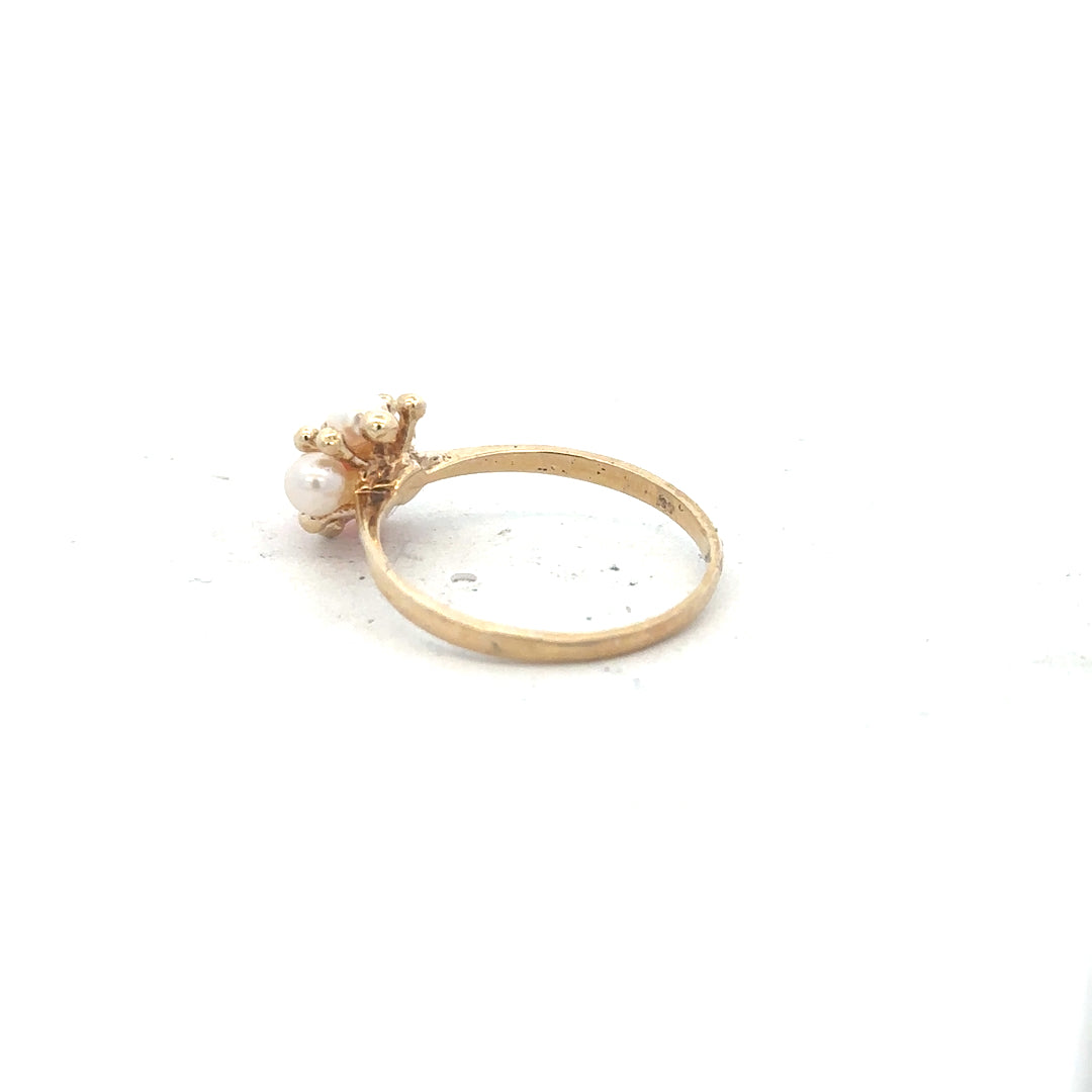 9ct yellow gold ring in size Q with a smooth band, unbranded jewelry piece displayed against a neutral background.