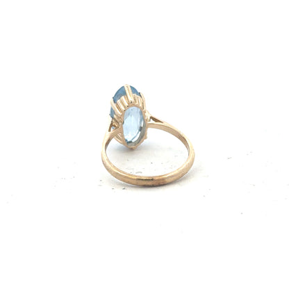 9ct yellow gold ring in size Q with a smooth polished finish, unbranded jewelry displayed on a plain background.