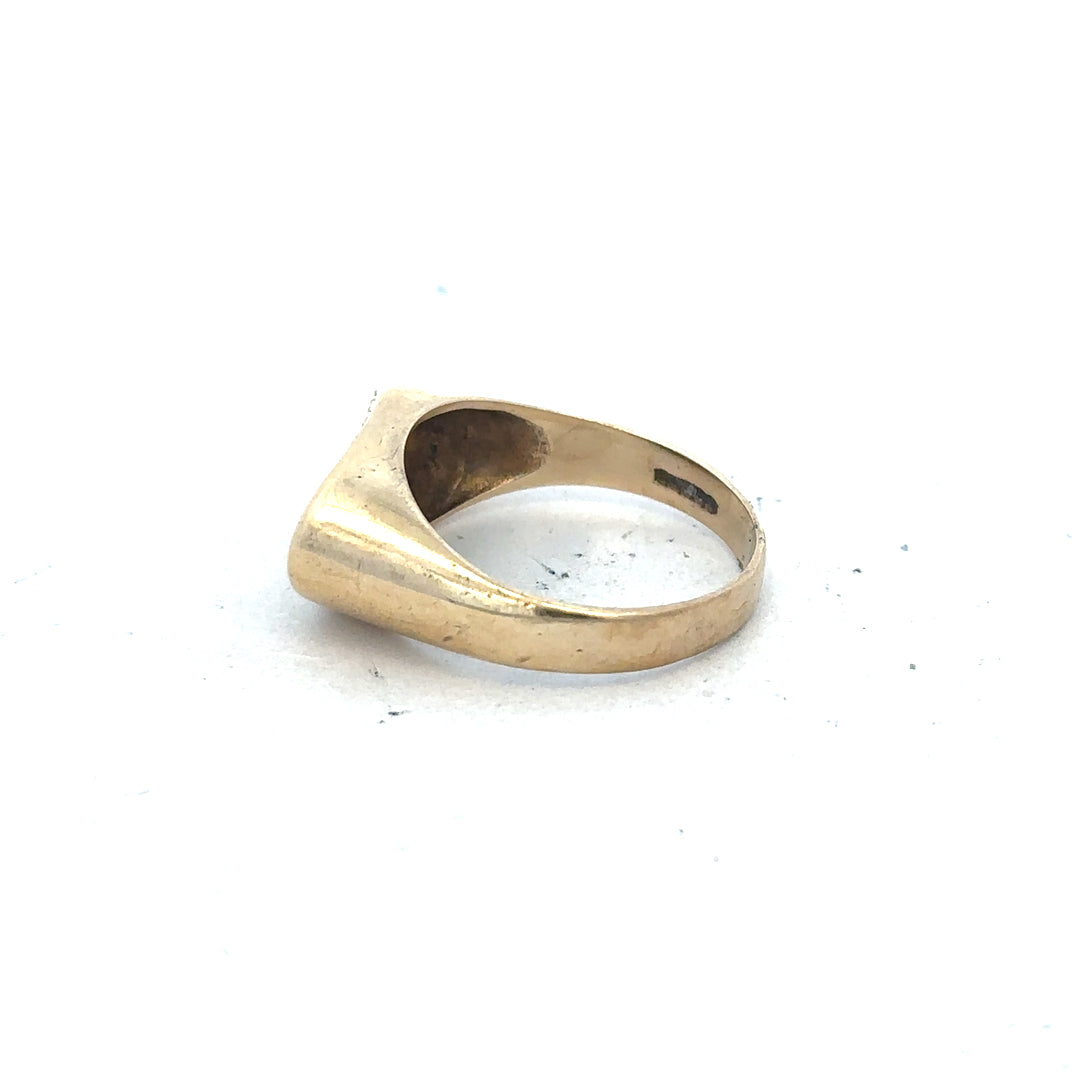 9ct yellow gold ring in size R with a smooth band, unbranded, shown in a close-up detail image.