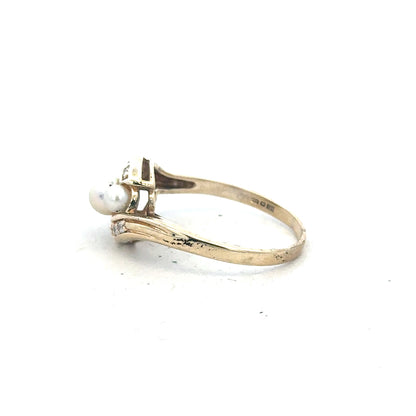 9ct yellow gold ring in size R with a smooth polished finish, unbranded jewelry piece.