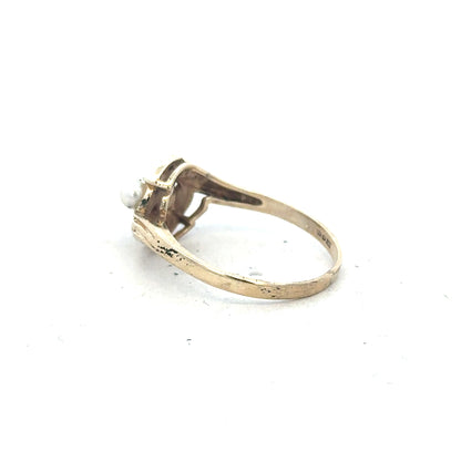 9ct yellow gold ring in size R with a smooth band, unbranded, showcasing a polished finish and classic design.