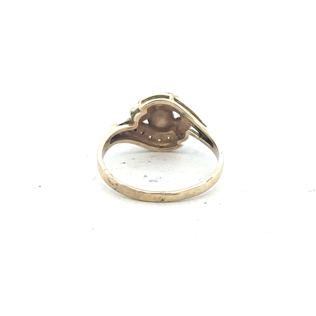 9ct yellow gold ring in size R with a smooth band, unbranded, shiny finish, showcasing elegant jewelry craftsmanship.
