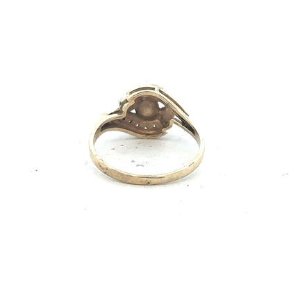 9ct yellow gold ring in size R with a smooth band, unbranded, shiny finish, showcasing elegant jewelry craftsmanship.