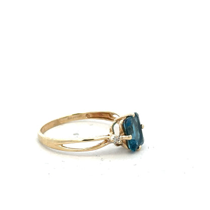 Yellow gold ring in size S, unbranded 9ct gold ring with a smooth polished finish, shown from a frontal view.