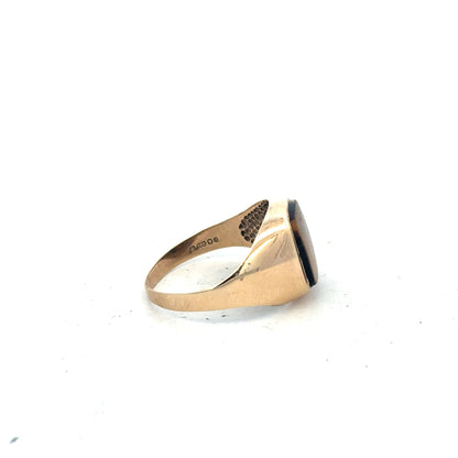 9ct yellow gold ring size T1/2 with a smooth band, unbranded, shown from a side angle against a white background.