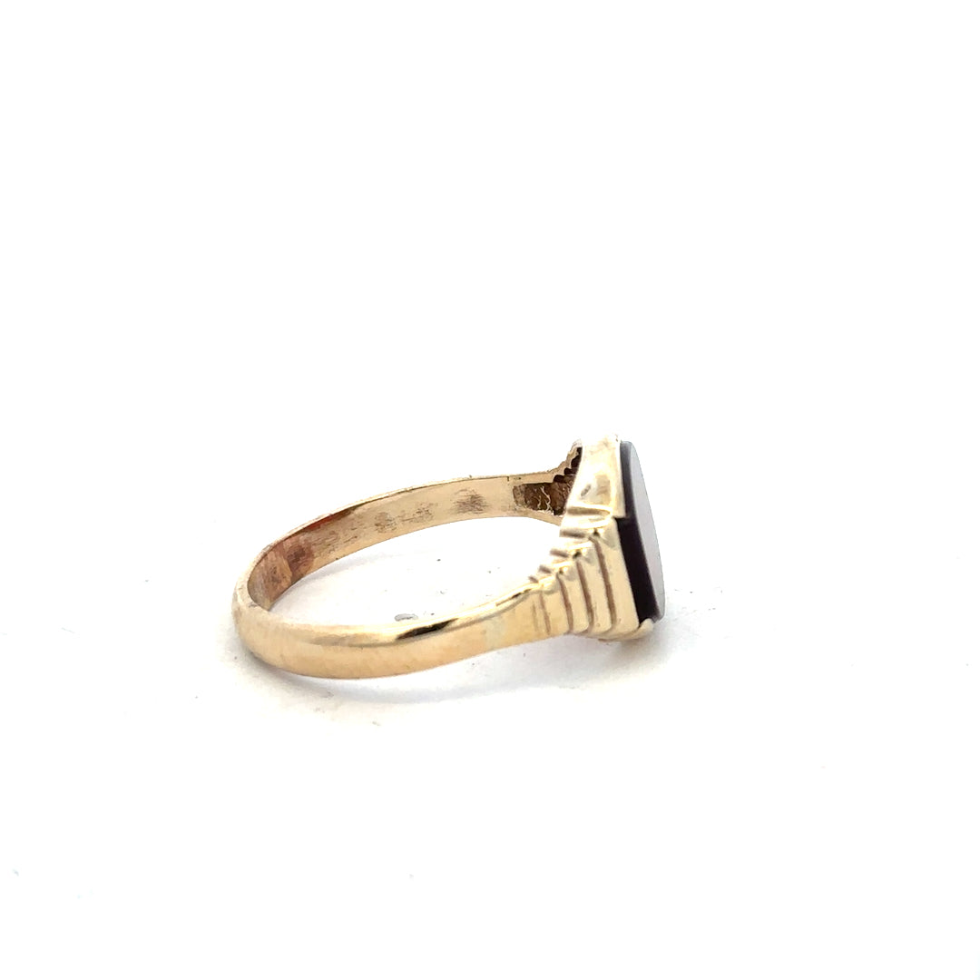 9ct yellow gold ring size Y1/2 with a smooth band, unbranded jewelry, shown in a close-up image.