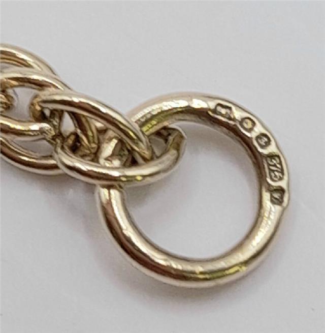 9ct yellow gold rope chain, 16-inch length, 9.4g, unbranded, detailed close-up of the elegant gold chain.