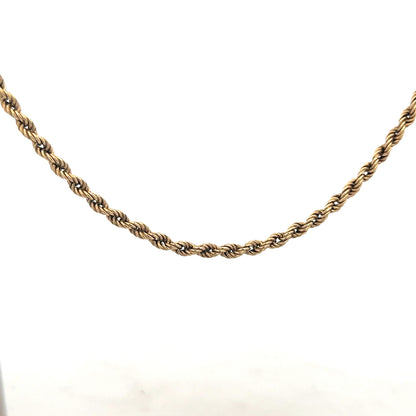 9ct yellow gold rope chain, unbranded, 7g, showing the detailed twisted design and polished finish of the jewelry.