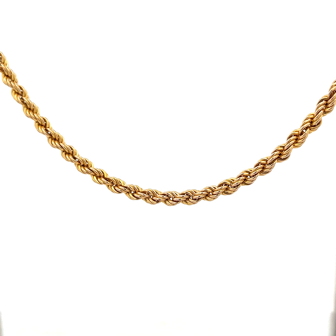 9ct yellow gold rope chain weighing 9.4g, unbranded jewelry chain with detailed braided design, close-up view.