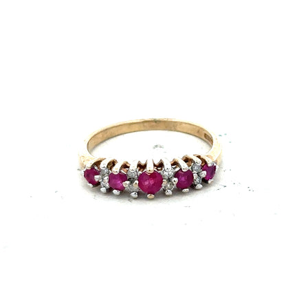 9ct yellow gold ruby and diamond ring in size J½, featuring a vibrant ruby center and sparkling diamonds.