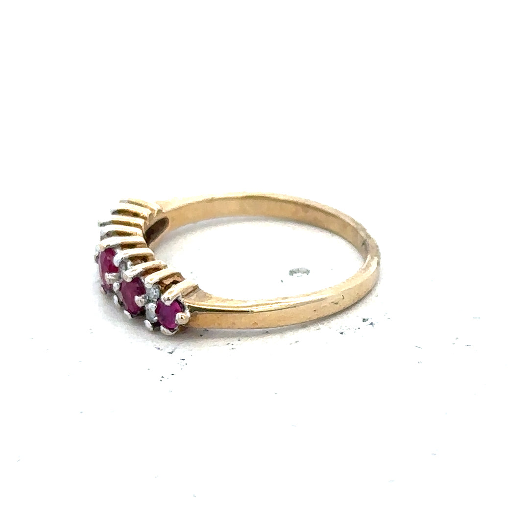 9ct yellow gold ruby and diamond ring, size J1/2, featuring a central ruby and surrounding diamonds.