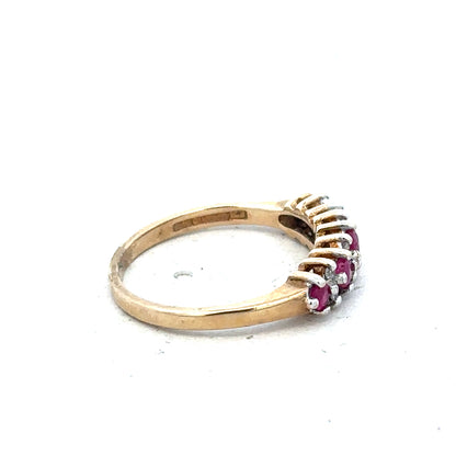 9ct yellow gold ring with ruby and diamond accents, size J1/2, featuring a detailed design and polished finish.