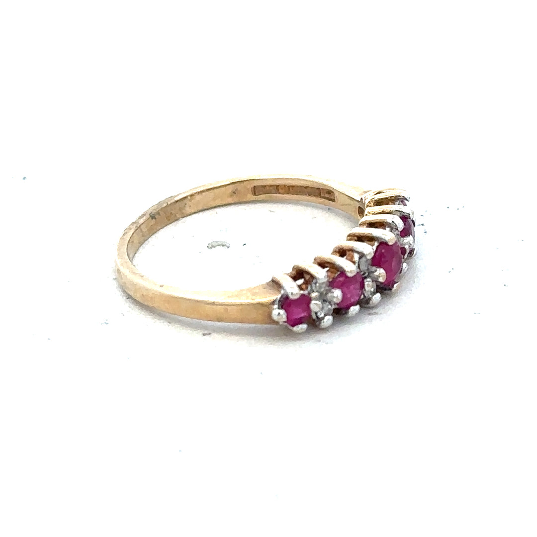 9ct yellow gold ruby and diamond ring, size J1/2, featuring a vibrant ruby center with sparkling diamonds.