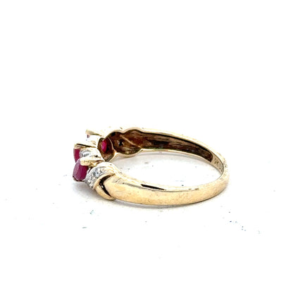 9ct yellow gold ruby and diamond ring in size L, featuring a vibrant ruby centerpiece with sparkling diamonds.