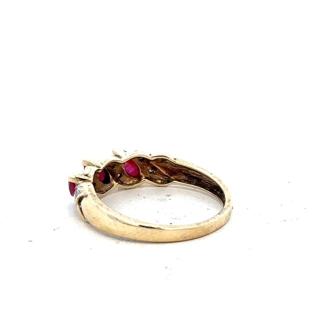 9ct yellow gold ring with ruby and diamond accents, size L, featuring a detailed design on a plain background.