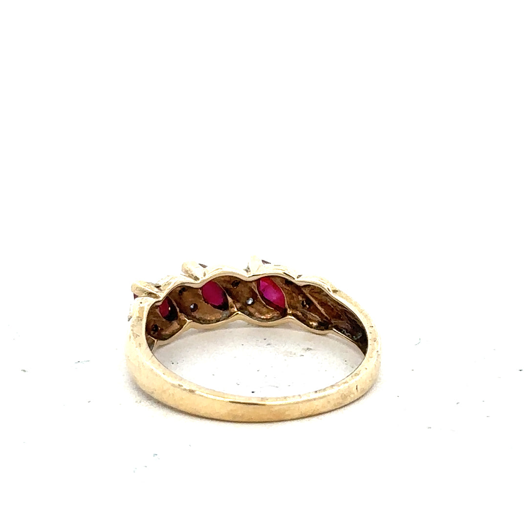9ct yellow gold ruby and diamond ring in size L, featuring a central ruby with diamond accents, unbranded jewelry piece.