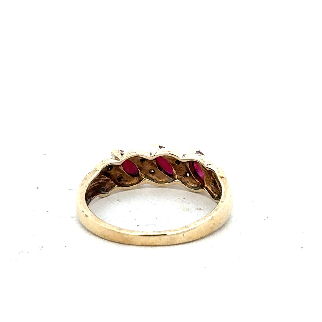 9ct yellow gold ring with ruby and diamond accents, size L, unbranded jewelry piece featuring intricate gemstone details.