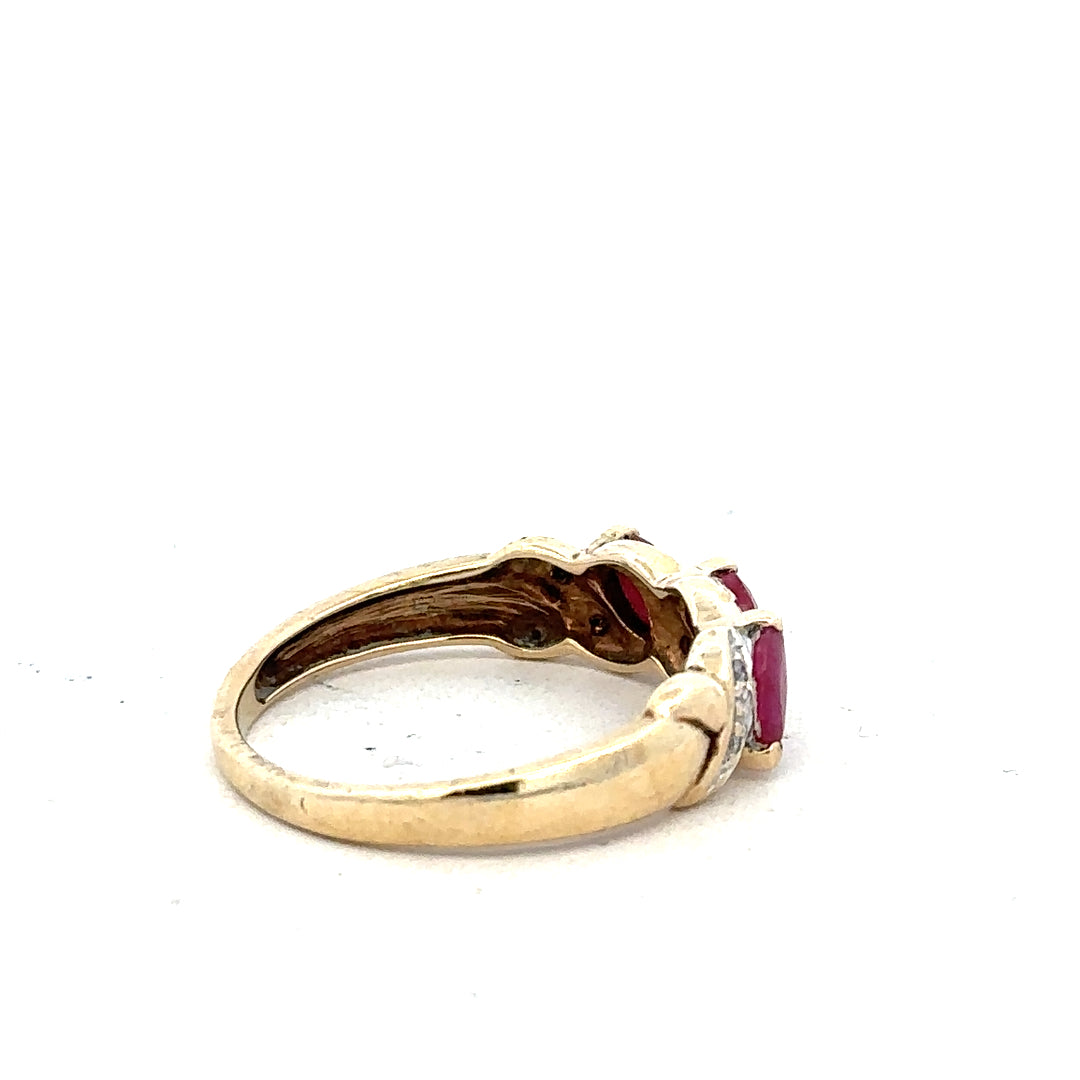 9ct yellow gold ruby and diamond ring, size L, featuring a central ruby stone with diamond accents.
