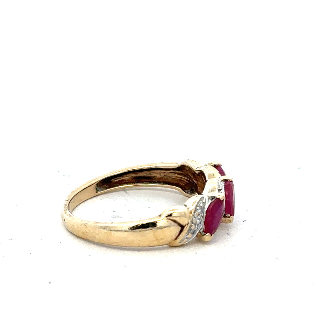 9ct yellow gold ruby and diamond ring in size L with intricate design, featuring a vibrant ruby and sparkling diamonds.