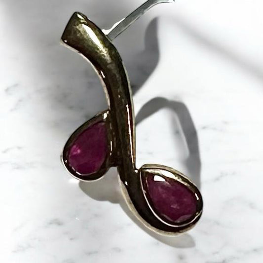 9ct yellow gold ruby pendant showing a vibrant red ruby gemstone on a delicate gold chain, unbranded jewelry accessory.