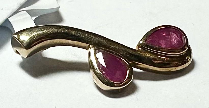 9ct yellow gold ruby pendant featuring a vibrant ruby gemstone, weighs 1.2g, unbranded jewelry accessory.