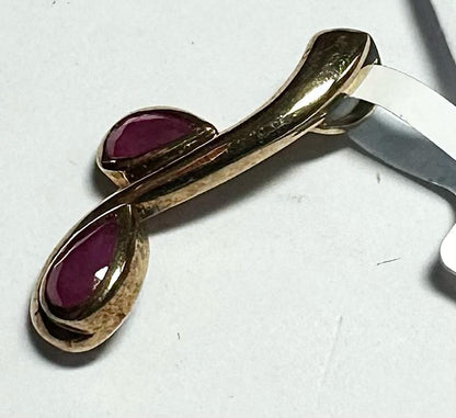 9ct yellow gold ruby pendant with a small gemstone, weighs 1.2g, unbranded, showcasing a classic jewelry design.
