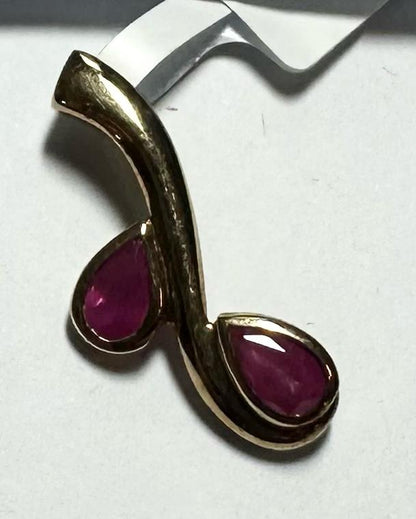 9ct yellow gold ruby pendant weighing 1.2g, featuring a vibrant ruby gemstone in a classic pendant design