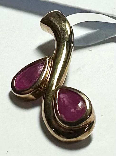 9ct yellow gold ruby pendant with a central red ruby gemstone, featuring a delicate design and lightweight 1.2g weight.