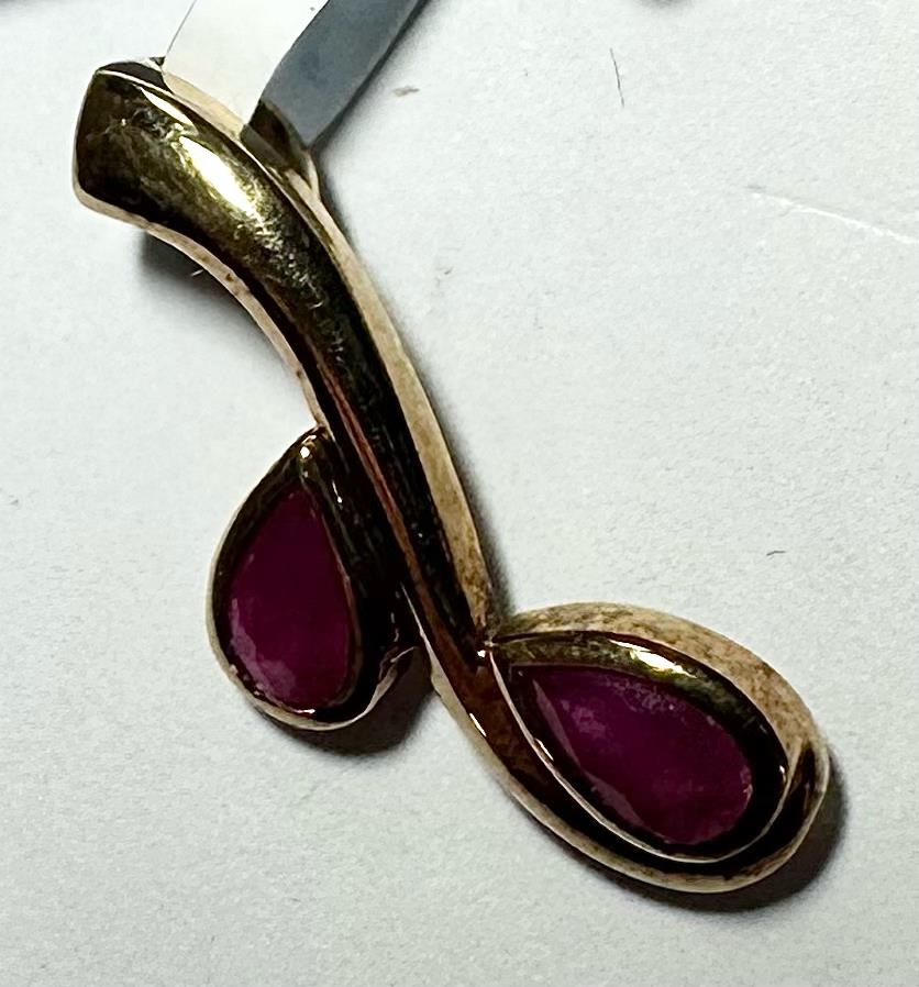 9ct yellow gold ruby pendant, unbranded, featuring a vibrant ruby gemstone, weighs 1.2g, elegant jewelry accessory.