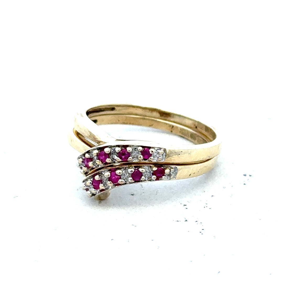 9ct yellow gold ruby ring in size O, featuring a central red ruby gemstone and a polished gold band.