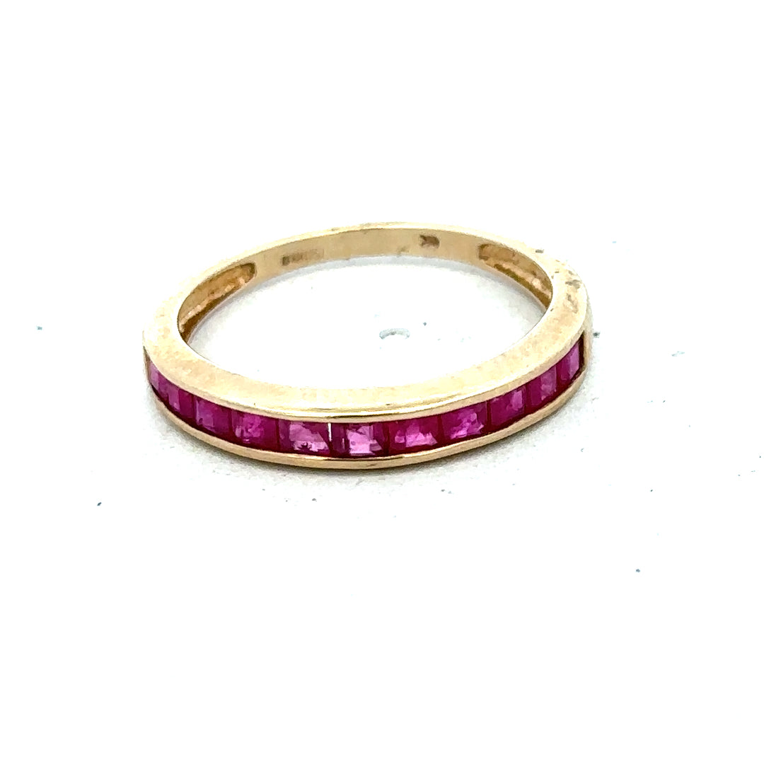 9ct yellow gold ruby ring size P1/2 with a central ruby gemstone and gold band, unbranded jewelry accessory.