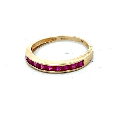 9ct yellow gold ruby ring in size P1/2, featuring a central ruby gemstone and a polished gold band.