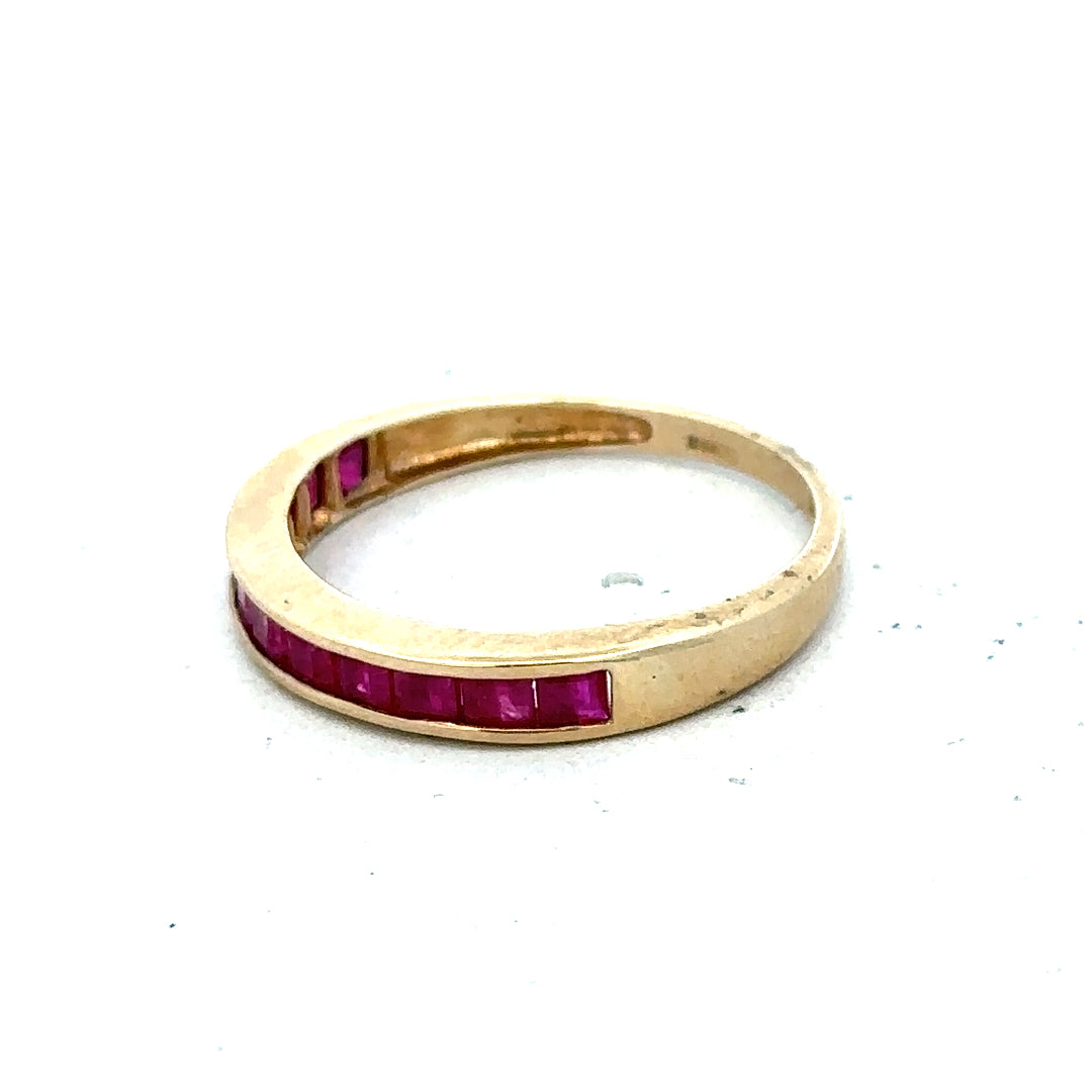 9ct yellow gold ruby ring size P1/2, unbranded, featuring a central ruby gemstone set in a polished yellow gold band.