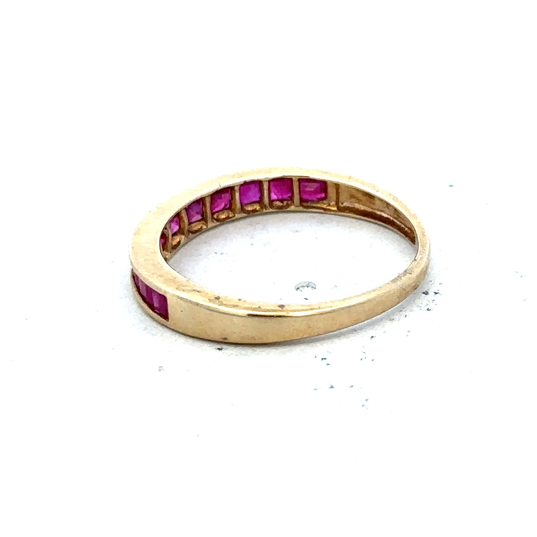 9ct yellow gold ruby ring size P1/2 featuring a vibrant red gemstone set in a classic gold band.