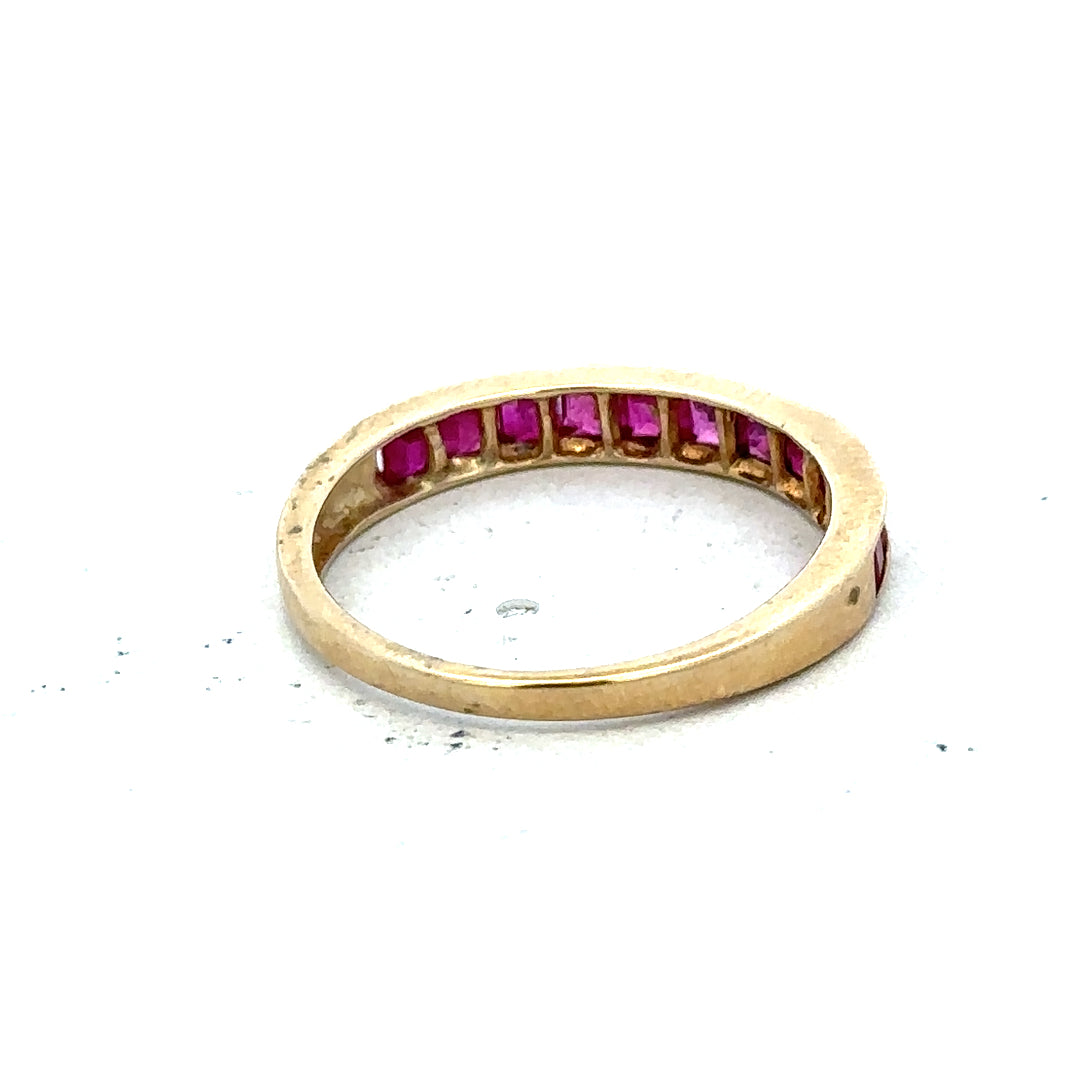 9ct yellow gold ruby ring size P1/2, unbranded, featuring a central red ruby gemstone set in a classic gold band.