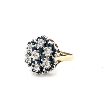 9ct yellow gold sapphire and diamond ring, size K, showcasing a detailed design with blue sapphire and sparkling diamonds.