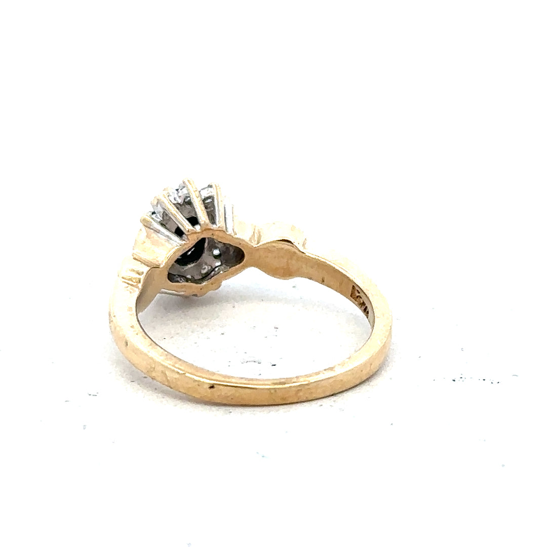 9ct yellow gold sapphire and diamond ring in size K1/2, featuring a central sapphire gemstone with diamond accents.