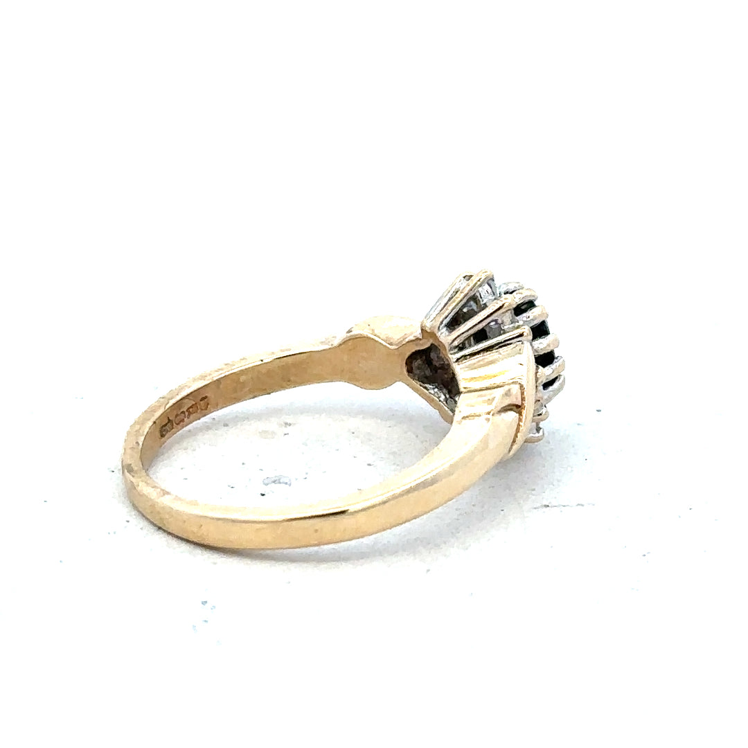 9ct yellow gold sapphire and diamond ring, size K1/2, featuring a central sapphire gemstone with diamond accents.
