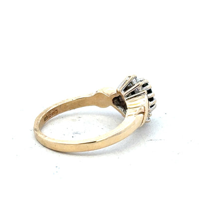 9ct yellow gold sapphire and diamond ring, size K1/2, featuring a central sapphire gemstone with diamond accents.