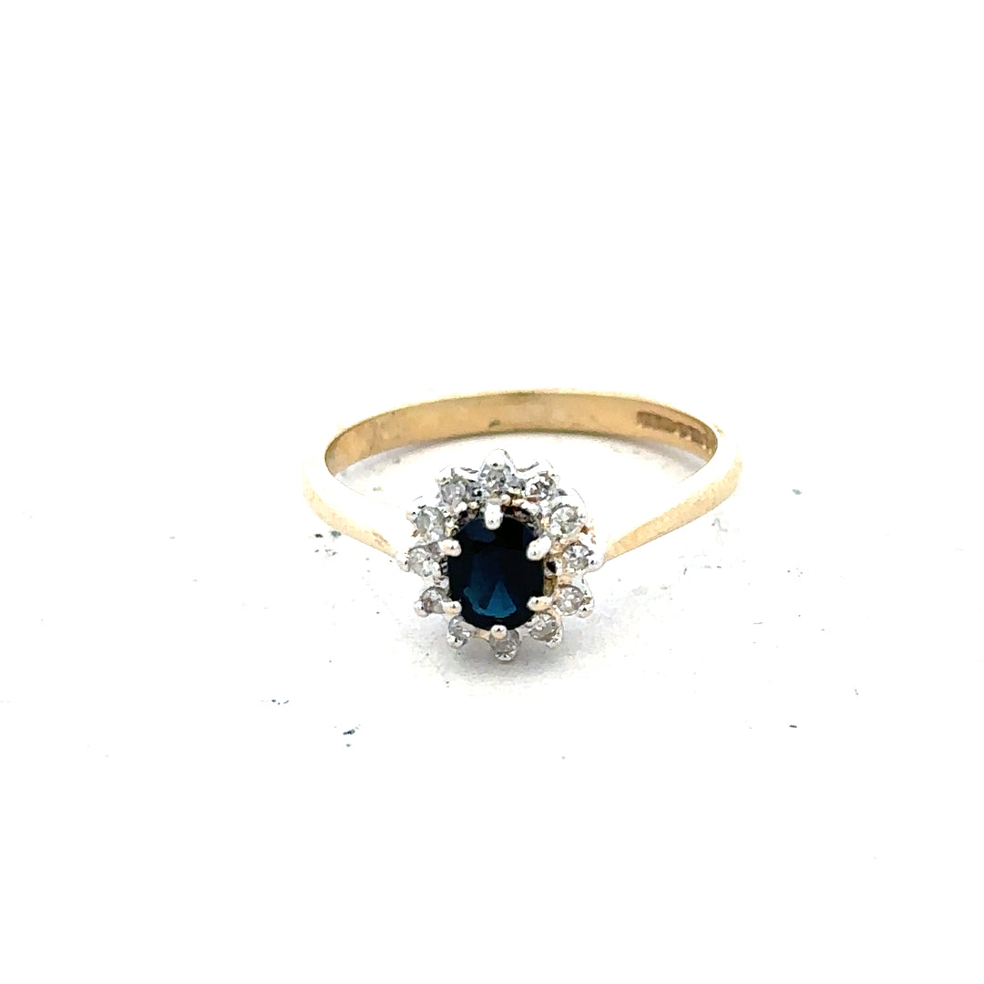 9ct yellow gold sapphire and diamond ring, size L, featuring a central sapphire and sparkling diamonds.