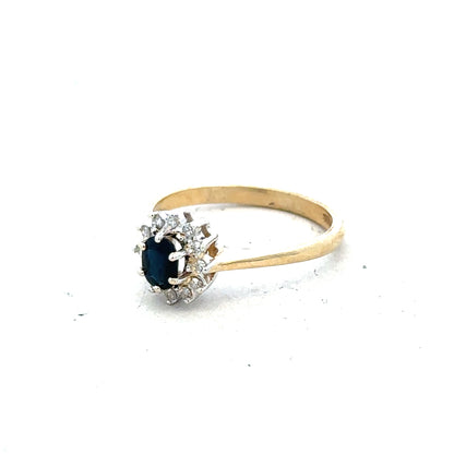 9ct yellow gold sapphire and diamond ring in size L, featuring a central blue sapphire with sparkling diamonds.
