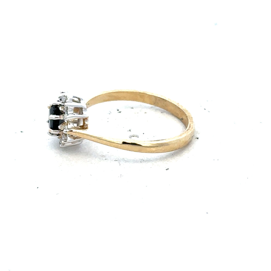 9ct yellow gold sapphire and diamond ring in size L, featuring a central sapphire with surrounding diamonds.