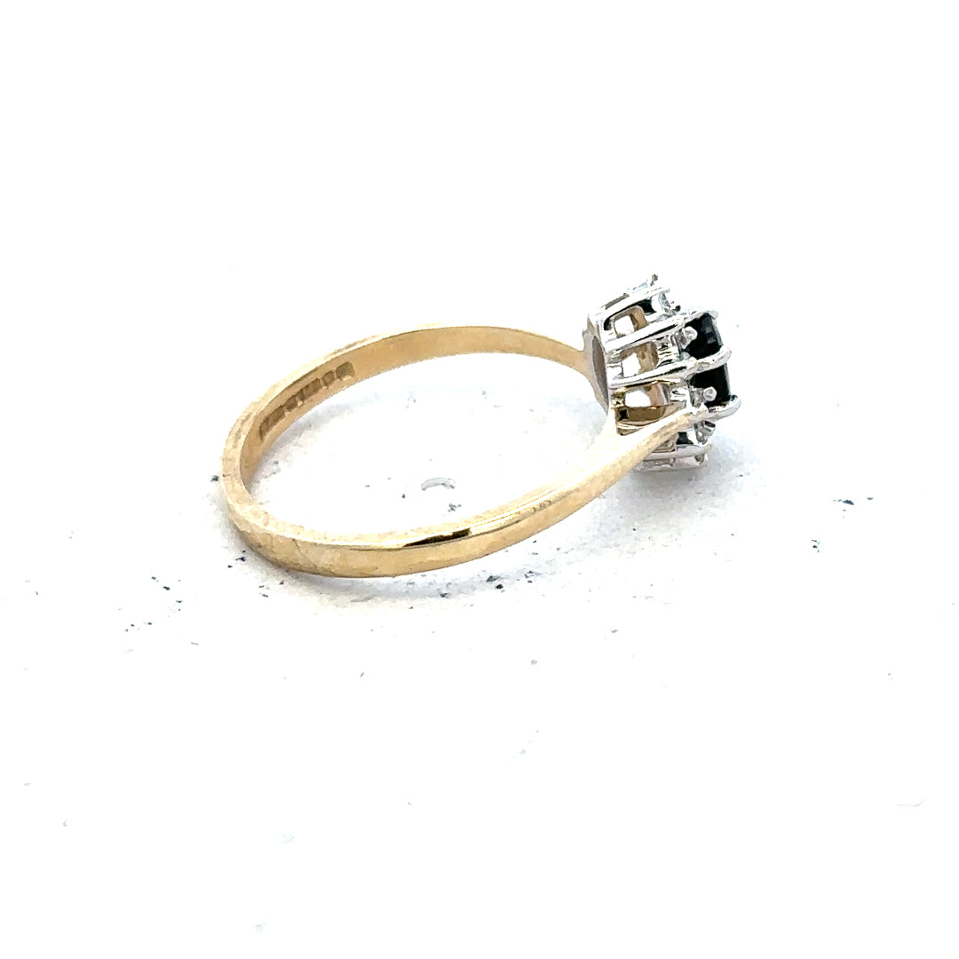 9ct yellow gold sapphire and diamond ring in size L, featuring a central sapphire and sparkling diamonds.