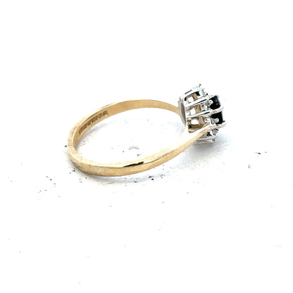 9ct yellow gold sapphire and diamond ring in size L, featuring a central sapphire and sparkling diamonds.